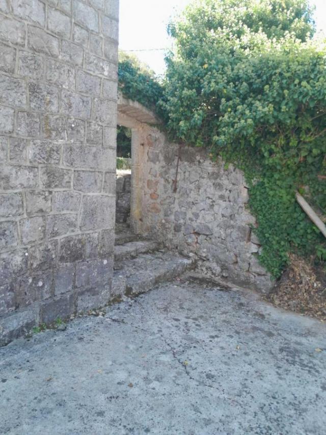 Big land with two stone houses