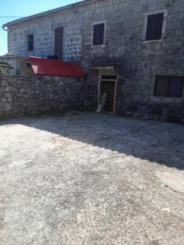 Big land with two stone houses