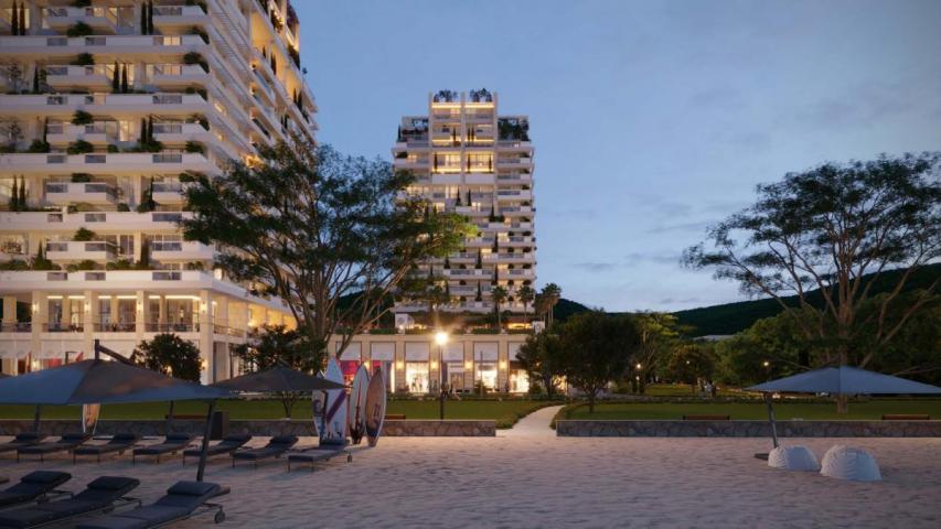 Luxury hotel with 212 residences, 144 rooms, and prime location near beach & city center