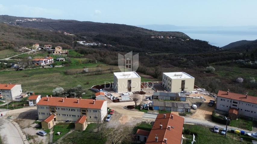 Labin, luxury apartment in a new building with a sea view