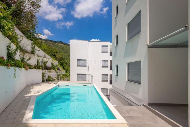 OPATIJA, CENTER - apartment in a superb new building with sea view, shared pool, garage