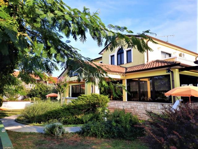 Umag-surroundings, business building and apartment house near the city