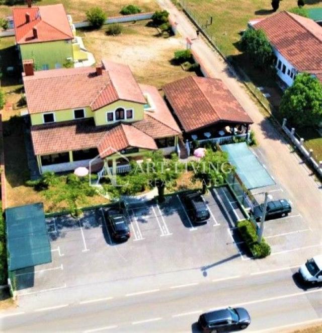 Umag-surroundings, business building and apartment house near the city