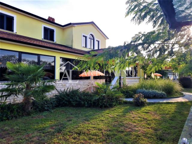 Umag-surroundings, business building and apartment house near the city