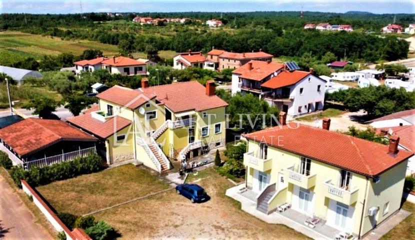 Umag-surroundings, business building and apartment house near the city