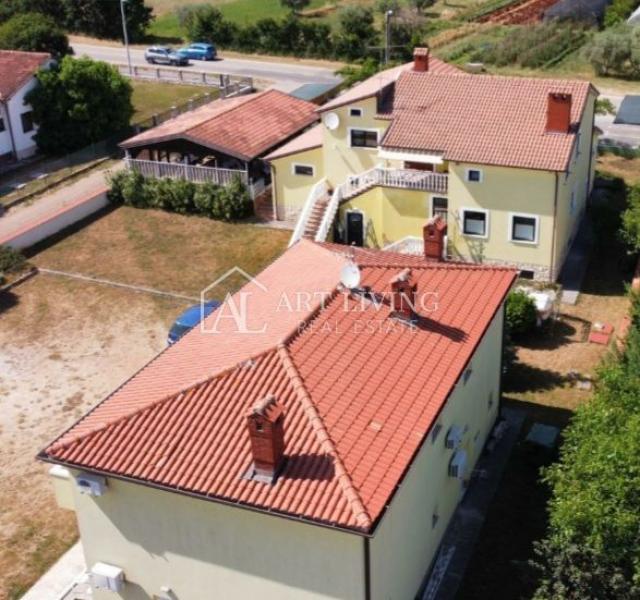 Umag-surroundings, business building and apartment house near the city