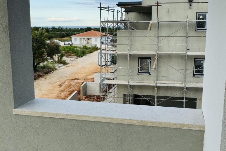 Istra, Umag, NOVOGRADNJA, Stan na drugom katu NKP 64, 54 m2