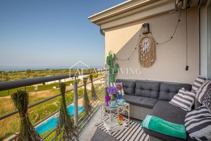 Istria, Umag, surroundings - a beautiful apartment with a swimming pool and an open sea view