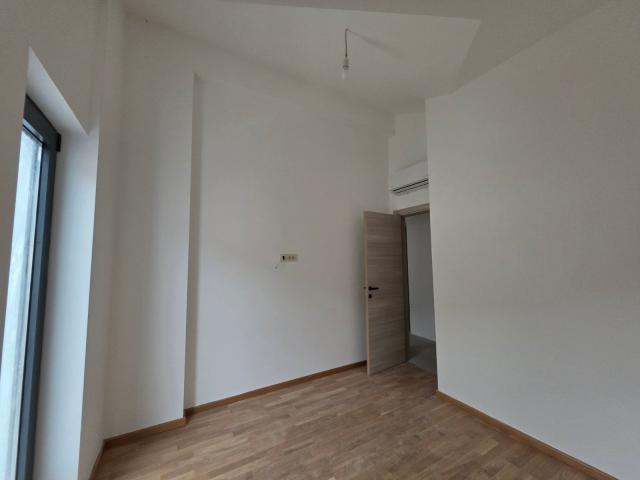 Dvosoban stan 53.10m² sa pogledom na more u novom stambeno poslovnoj zgradi-Budva, Adok