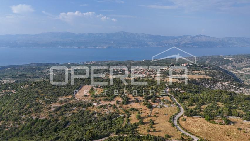 Prostrano poljoprivredno zemljište, 14.027 m2 s pogledom i uz pristupni put, Škr