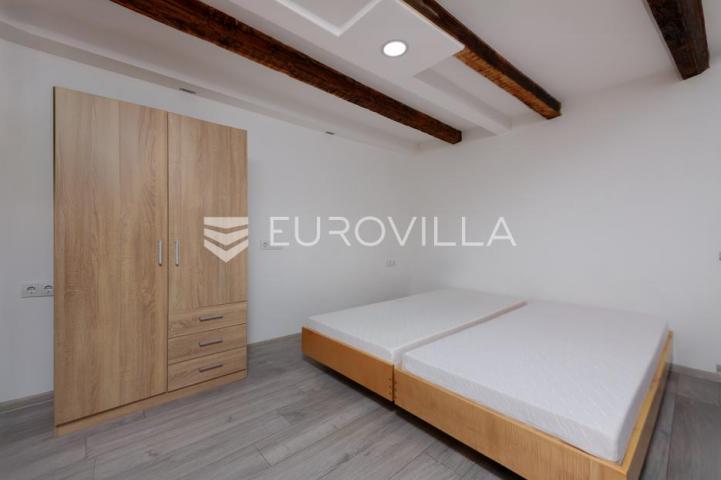 Krk, Milohnići, dvojna kamena kuća sa dvoetažnim trosobnim stanom 80 m²