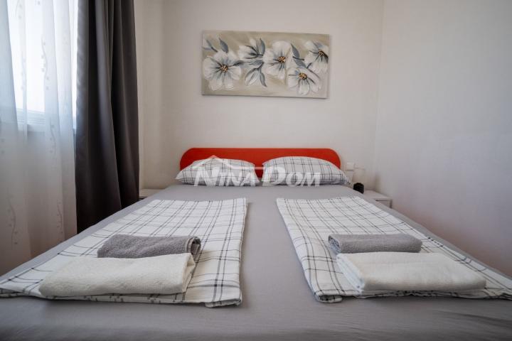 Apartmanska kuća s prostranom okućnicom. 