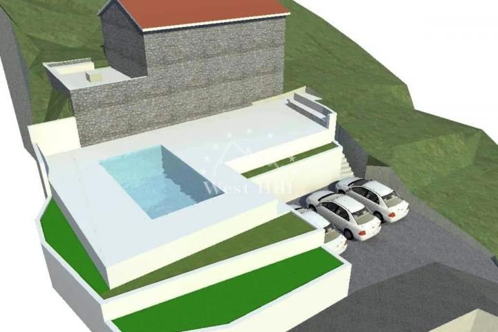 Kamena kuca u Zagori sa pogljedom na more