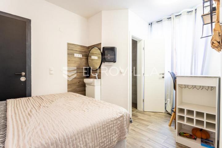 Tisno, NOVOGRADNJA, apartman u prizemlju, prvi red do mora, 48,51 m²