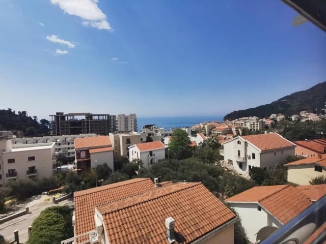 An apartment with a sea view in Petrovac is offered for sale. 