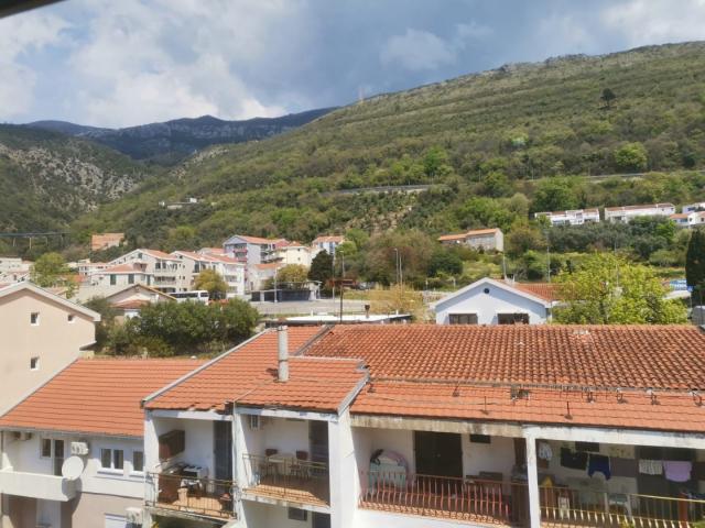 An apartment with a sea view in Petrovac is offered for sale. 