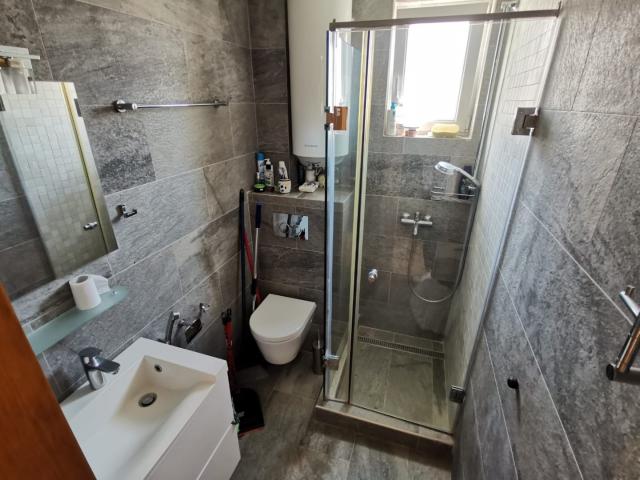 An apartment with a sea view in Petrovac is offered for sale. 