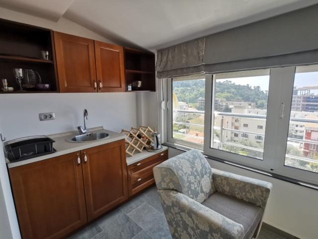 An apartment with a sea view in Petrovac is offered for sale. 