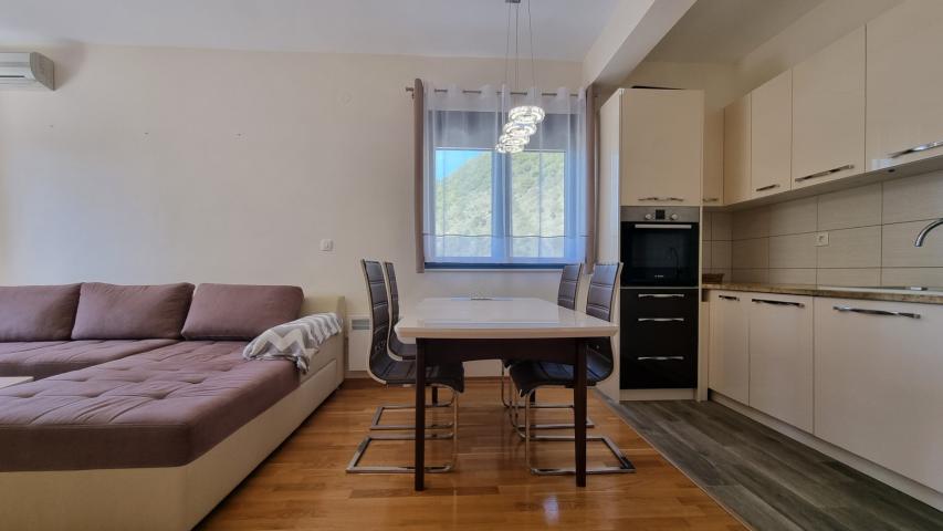 Apartment with spacious terrace and garage space, Becici