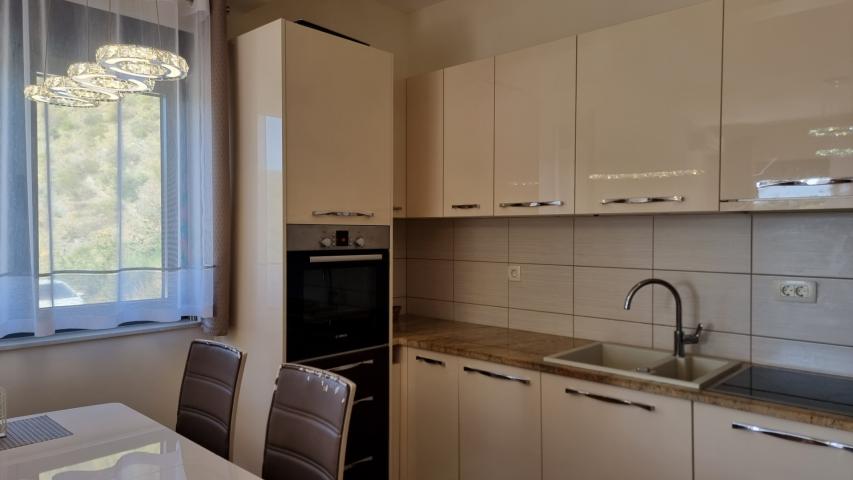 Apartment with spacious terrace and garage space, Becici