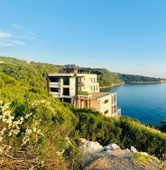 Villa on the first coastline with private beach and pool