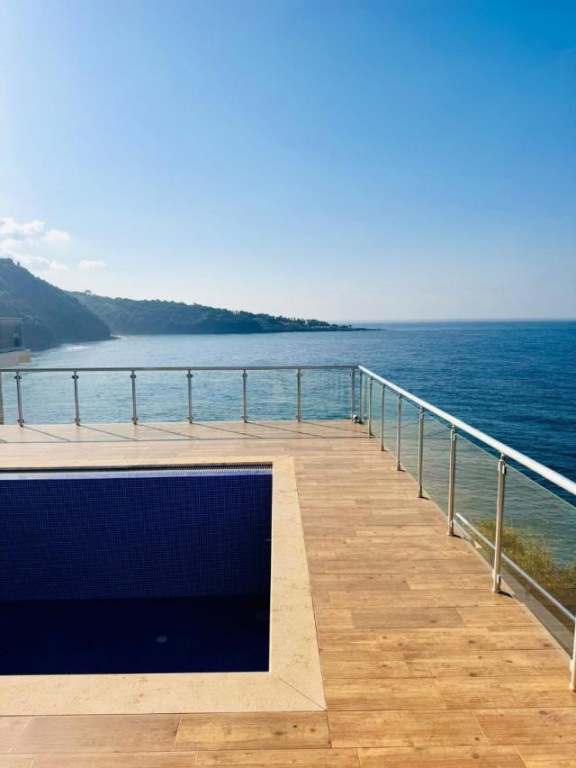 Villa on the first coastline with private beach and pool