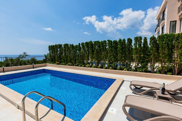 Townhouse with panoramic views of the Adriatic Sea in a gated complex in the Budva Riviera