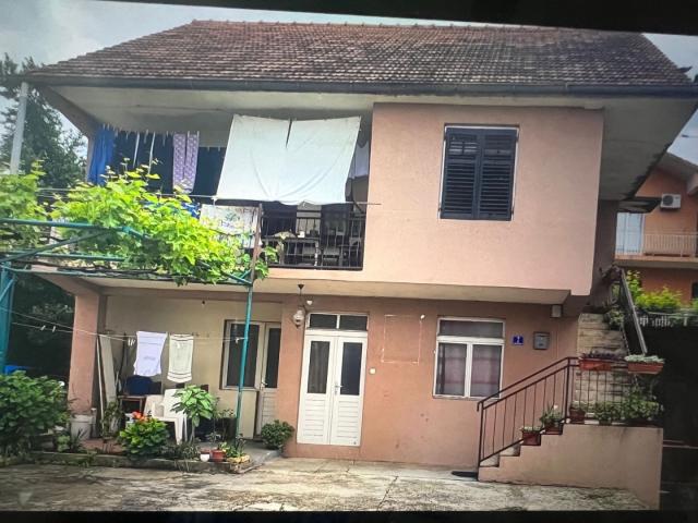 House in Tivat near the highway