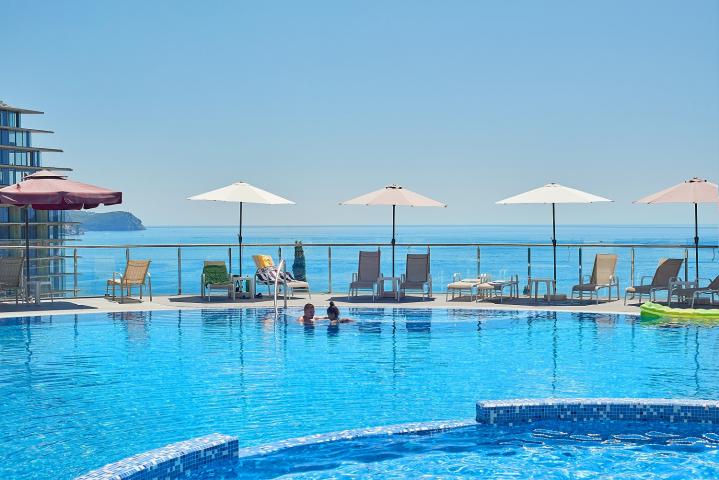 Premium apartment in a residential complex with a swimming pool located in Becici, a suburb of Budva