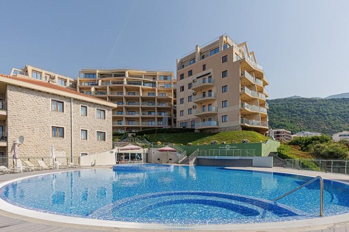 Premium apartment in a residential complex with a swimming pool located in Becici, a suburb of Budva