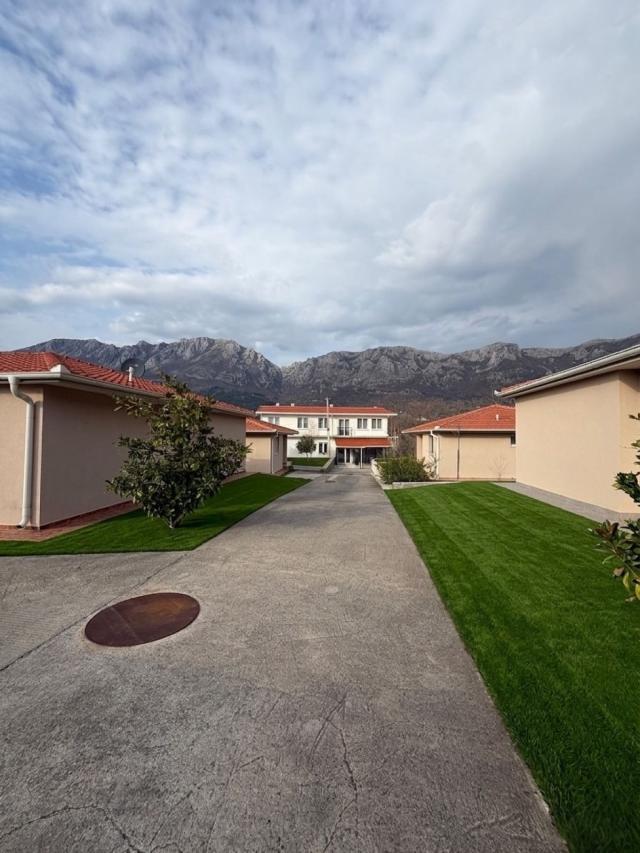 A 138 m² house is for sale in a cozy gated community in Bar, Montenegro.