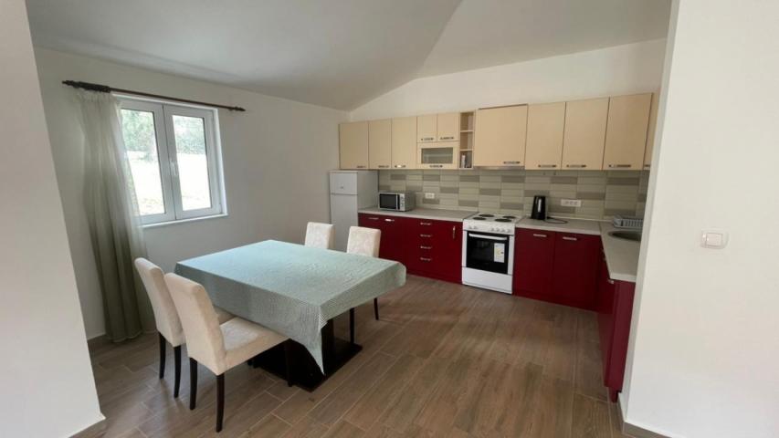 A 138 m² house is for sale in a cozy gated community in Bar, Montenegro.