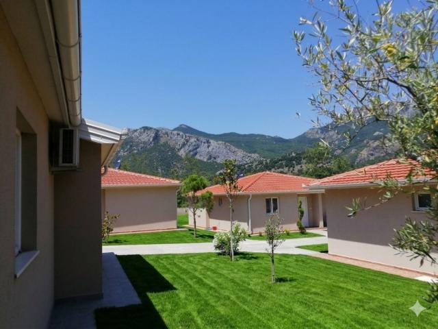 A 138 m² house is for sale in a cozy gated community in Bar, Montenegro.