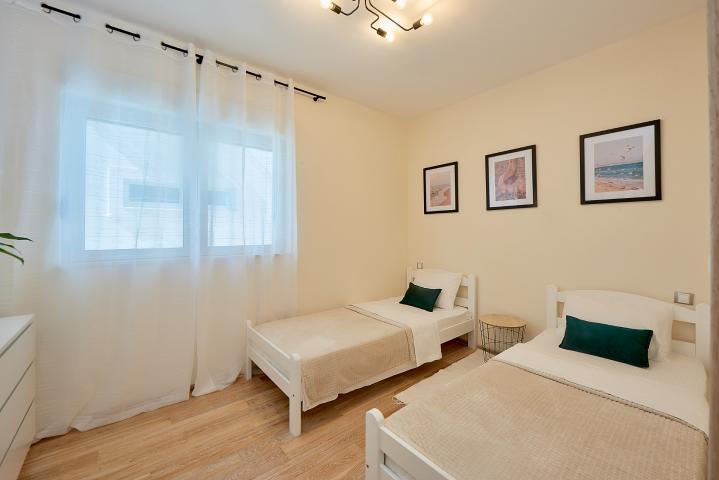 Furnished, two-bedroom apartment with partial sea view, 