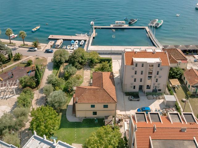 Urbanized land with a house, first line to the sea, 