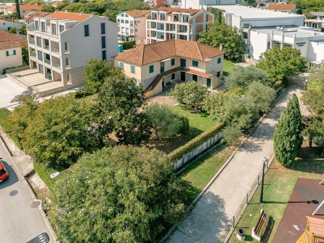 Urbanized land with a house, first line to the sea, 