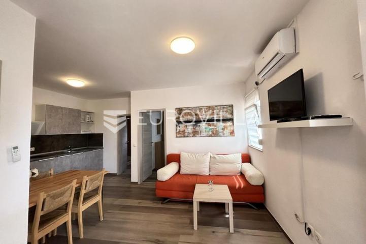 Vir, atraktivna apartmanska kuća s 4 stambene jedinice udaljene 150 m od plaže