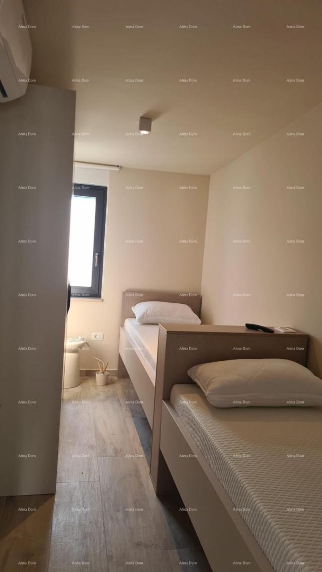 Stan Moderan apartman u bloku E s parkirnim mjestom i spremištem, u blizini Umaga!