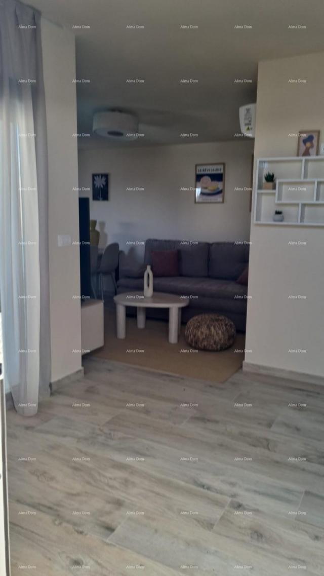 Stan Moderan apartman u bloku E s parkirnim mjestom i spremištem, u blizini Umaga!