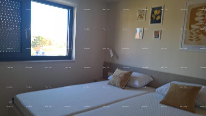 Stan Moderan apartman u bloku E s parkirnim mjestom i spremištem, u blizini Umaga!