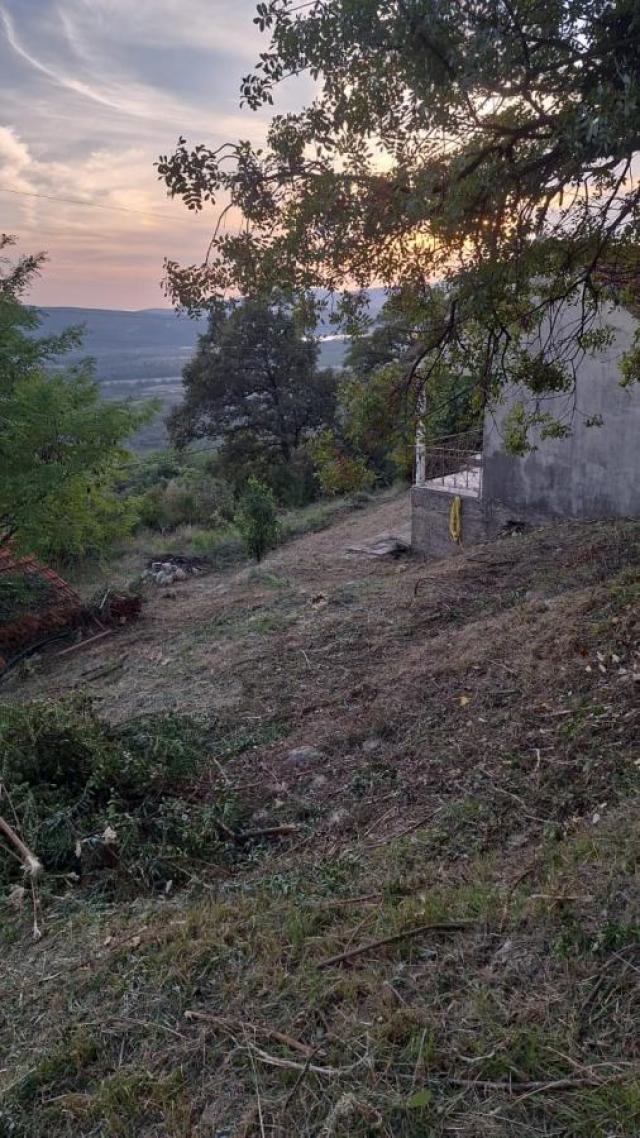 Urbanized Plot of 1700m2 with House Under Construction in Kotor, Kavac, Sea View of Tivat Bay