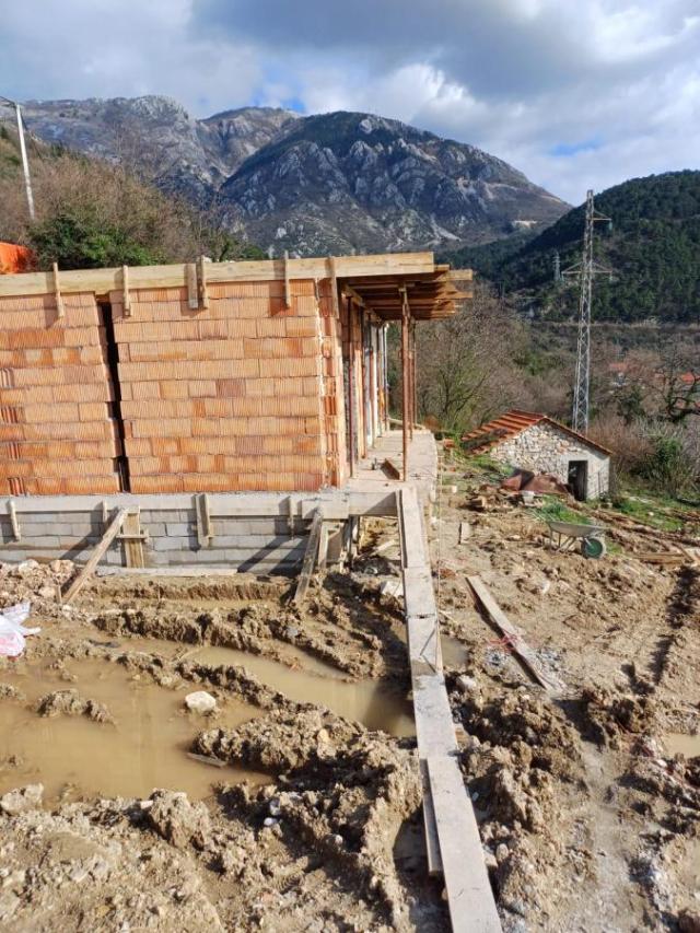 Urbanized Plot of 1700m2 with House Under Construction in Kotor, Kavac, Sea View of Tivat Bay