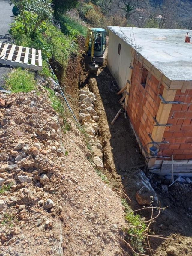 Urbanized Plot of 1700m2 with House Under Construction in Kotor, Kavac, Sea View of Tivat Bay