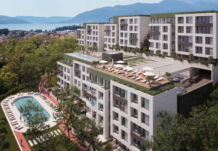 Stan sa 2 spavaće sobe u modernom stambenom kompleksu u izgradnji sa bazenima i parkingom, Tivat