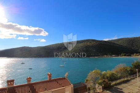 Rabac, residential and commercial building first row to the sea