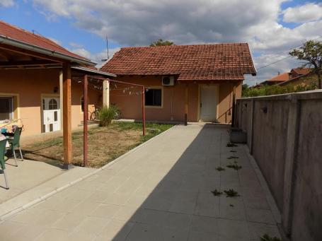 A house with a summer house in the yard