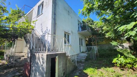 A two-story legal house in Sutomore below the highway