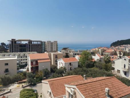 An apartment with a sea view in Petrovac is offered for sale. 