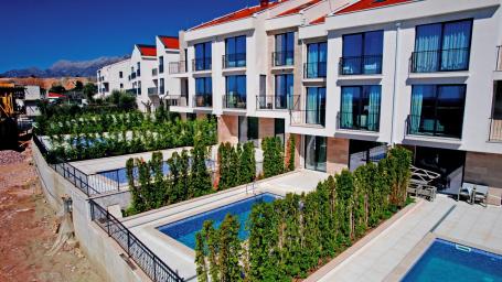 Townhouse with panoramic sea view in a gated community in Budva Riviera