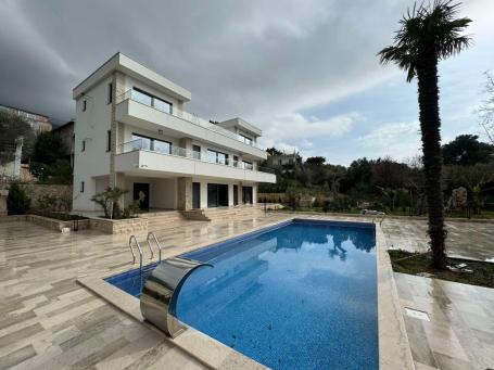 A new modern villa near the sea is offered for sale. 